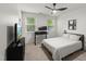 Bright bedroom with large windows, neutral walls, and comfortable carpeting at 3601 Lily Orchard Way, Apex, NC 27539
