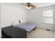 Bedroom featuring neutral walls, carpeted floor, ceiling fan, and natural light at 3601 Lily Orchard Way, Apex, NC 27539
