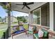 Charming front porch with ceiling fan, stone accents, and comfortable seating perfect for relaxing outdoors at 3601 Lily Orchard Way, Apex, NC 27539