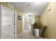 Hallway featuring neutral carpet and multiple doors leading to various rooms at 3601 Lily Orchard Way, Apex, NC 27539