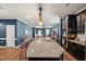Spacious kitchen features a large granite island, stainless steel appliances, and abundant cabinet space at 3601 Lily Orchard Way, Apex, NC 27539