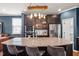 Stylish kitchen island with granite countertops, pendant lighting, and modern appliances at 3601 Lily Orchard Way, Apex, NC 27539