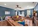 Cozy living room features hardwood floors, a fireplace, and comfortable seating, perfect for relaxation and gatherings at 3601 Lily Orchard Way, Apex, NC 27539