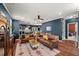 Open-concept living room with hardwood floors connecting to kitchen and dining areas, ideal for entertaining at 3601 Lily Orchard Way, Apex, NC 27539