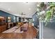Open-concept living space featuring hardwood floors, fireplace, and seamless flow into the kitchen at 3601 Lily Orchard Way, Apex, NC 27539