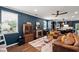 Comfortable living room with fireplace, hardwood floors, and ample natural light, showcasing a relaxed ambiance at 3601 Lily Orchard Way, Apex, NC 27539