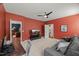Comfortable living room featuring a cozy sofa, television, and a desk at 3601 Lily Orchard Way, Apex, NC 27539
