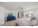 Spacious main bedroom with light carpet, ceiling fan, view to walk-in closet and ensuite bathroom at 3601 Lily Orchard Way, Apex, NC 27539