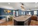 Spacious open floorplan featuring kitchen island, dining area, and seamless flow into the living room at 3601 Lily Orchard Way, Apex, NC 27539