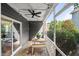 Relaxing screened porch with a dining table, ceiling fan, and string lights at 3601 Lily Orchard Way, Apex, NC 27539