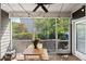Cozy screened porch with outdoor seating and a view of the lush backyard at 3601 Lily Orchard Way, Apex, NC 27539