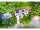 Gorgeous aerial view of the home, set amidst lush greenery and beautiful landscaping at 429 Carolina Cir, Durham, NC 27707
