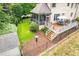 Aerial shot of a backyard featuring lawn, patio, landscaping and shed at 429 Carolina Cir, Durham, NC 27707