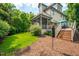 Beautiful backyard with a lawn, flower beds, a screened in porch and a deck at 429 Carolina Cir, Durham, NC 27707
