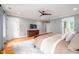 Bedroom features a ceiling fan, hardwood floors, neutral-toned walls, and access to the bathroom at 429 Carolina Cir, Durham, NC 27707