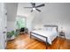 Tranquil bedroom featuring hardwood floors, natural light and comfortable bed at 429 Carolina Cir, Durham, NC 27707
