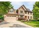 Beautiful brick home featuring stone accents, an attached garage, and a manicured front yard at 429 Carolina Cir, Durham, NC 27707
