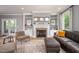 Comfortable living room featuring a fireplace with built-in shelves and a plush leather sofa at 429 Carolina Cir, Durham, NC 27707