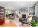 Open-concept living area with hardwood floors, a fireplace, and a view of the dining room at 429 Carolina Cir, Durham, NC 27707