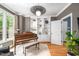 Cozy living room with hardwood floors, a built-in bookshelf, and a decorative light fixture at 429 Carolina Cir, Durham, NC 27707