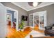 Versatile home office space featuring hardwood floors, and glass doors leading to the foyer at 429 Carolina Cir, Durham, NC 27707
