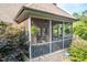 Cozy screened porch with access to deck and brick exterior providing privacy at 429 Carolina Cir, Durham, NC 27707