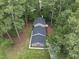 Aerial view of a home showing the roofline and surrounding mature trees at 4301 Azalea Dr, Raleigh, NC 27612