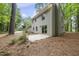 Backyard view with mature trees, neutral paint, and a patio at 4301 Azalea Dr, Raleigh, NC 27612