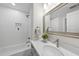 Bright bathroom features white subway tile, modern fixtures, and a vanity with ample counter space at 4301 Azalea Dr, Raleigh, NC 27612