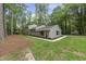 Well-maintained home with a tidy lawn and landscaping in a serene, wooded setting at 4301 Azalea Dr, Raleigh, NC 27612