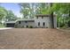 Exterior shot of the home showcasing its well-maintained lawn and attached garage at 4301 Azalea Dr, Raleigh, NC 27612