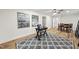 Inviting living room featuring stylish decor, a ceiling fan, an area rug, and an adjacent dining area at 4301 Azalea Dr, Raleigh, NC 27612