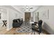 Cozy living room featuring a brick fireplace, a ceiling fan, and sliding glass doors at 4301 Azalea Dr, Raleigh, NC 27612