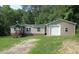 Charming single-story home with a metal roof, front porch, and an attached one-car garage on a sunny day at 440 Montgomery Rd, Franklinton, NC 27525