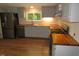 Modern kitchen with butcher block countertops, stainless appliances, sink and a bright window overlooking the outdoors at 440 Montgomery Rd, Franklinton, NC 27525