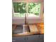 Stylish kitchen sink with butcher block counters, modern faucet, stainless steel features, and natural light at 440 Montgomery Rd, Franklinton, NC 27525