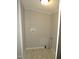 Functional laundry area with hookups, tile floors, and neutral decor, ready for appliances at 440 Montgomery Rd, Franklinton, NC 27525