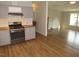 Spacious kitchen flows into the living room, featuring modern appliances, and a cozy fireplace at 440 Montgomery Rd, Franklinton, NC 27525