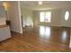 Cozy living room with fireplace seamlessly connected to the modern kitchen, with lots of natural light at 440 Montgomery Rd, Franklinton, NC 27525