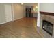 Open concept living space with fireplace, seamlessly connecting to the modern kitchen with stainless steel appliances at 440 Montgomery Rd, Franklinton, NC 27525
