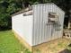 Exterior view of storage shed with siding and window in the backyard at 440 Montgomery Rd, Franklinton, NC 27525
