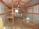 Interior view of storage shed with wooden work bench and peg board shelving at 440 Montgomery Rd, Franklinton, NC 27525