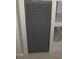Utility closet featuring a dark grey door, suitable for accessing essential home systems at 440 Montgomery Rd, Franklinton, NC 27525