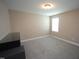 Bedroom with plush carpeting and natural light from the window, complemented by a dresser at 4416 Walker Hallow St, Raleigh, NC 27616