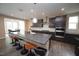 Open kitchen with a large island, stainless steel appliances, and sleek countertops at 4416 Walker Hallow St, Raleigh, NC 27616