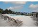 Community pool offering residents a refreshing escape with lounge chairs and umbrellas around it at 4416 Walker Hallow St, Raleigh, NC 27616