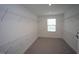 Spacious walk-in closet with carpet flooring and shelving for optimal storage at 4416 Walker Hallow St, Raleigh, NC 27616