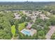 Aerial view of neighborhood homes with a community pool, surrounded by lush green trees and landscaping at 4622 Ludwell Branch Ct, Raleigh, NC 27612