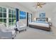 This bedroom features a ceiling fan, two chairs, and an area rug at 4622 Ludwell Branch Ct, Raleigh, NC 27612