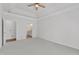 Spacious bedroom with carpet, ceiling fan and adjacent bathroom at 4622 Ludwell Branch Ct, Raleigh, NC 27612